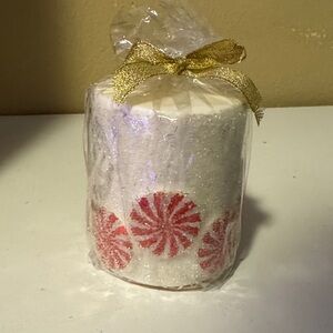 Festive White Candle with Red Peppermint Design